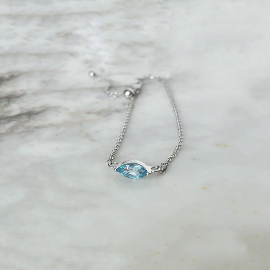 Pulsera en oro blanco 10k con topacio azul