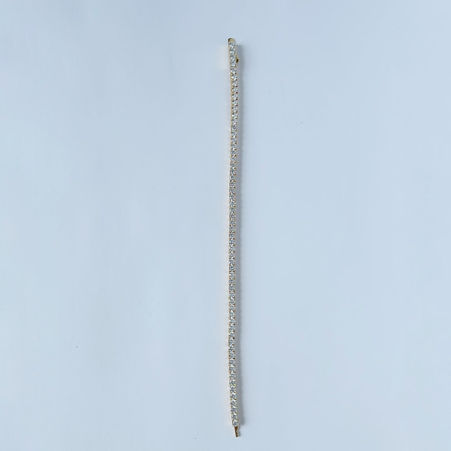 Pulsera tipo tenis en plata con baño de oro amarillo y circonitas 4ctw