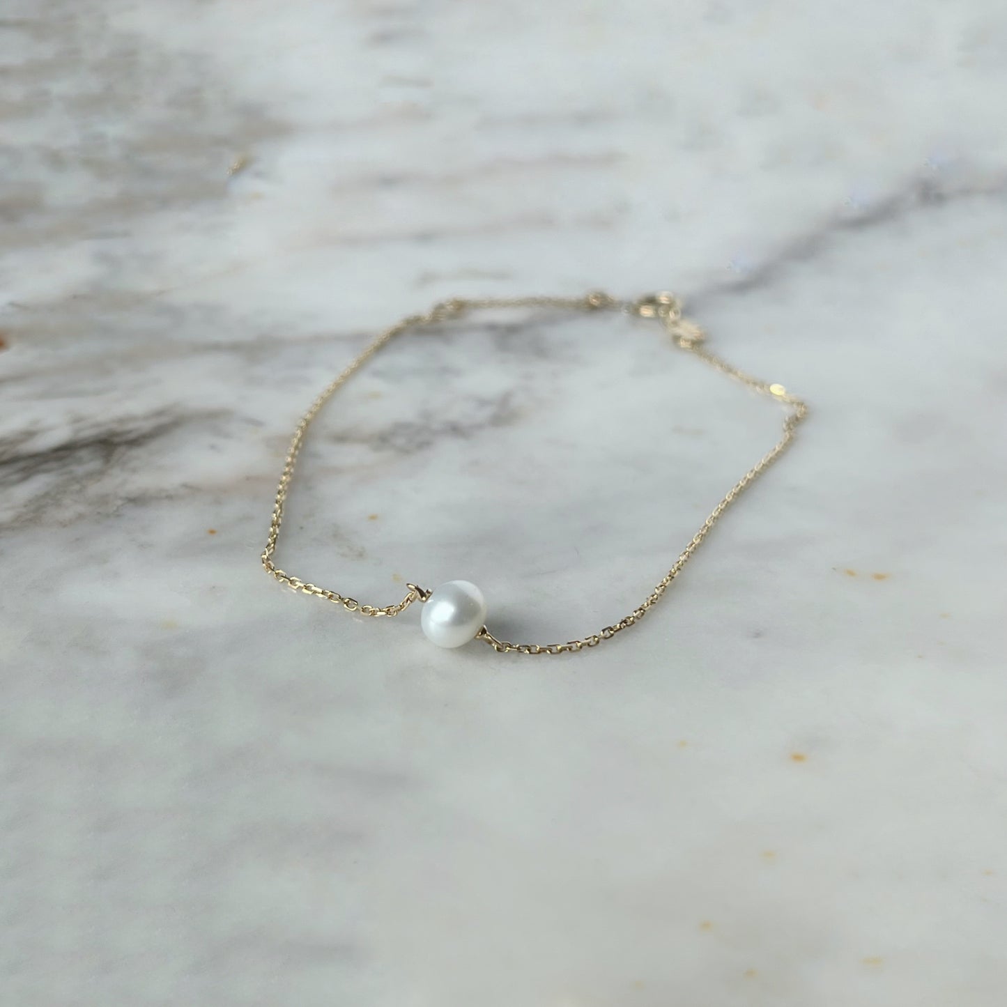 Pulsera en oro amarillo 14k y perla