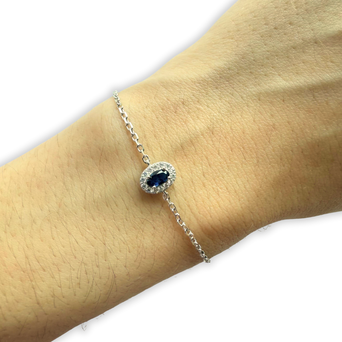 Pulsera de plata con circonita azul ovalada y halo de circonitas blancas