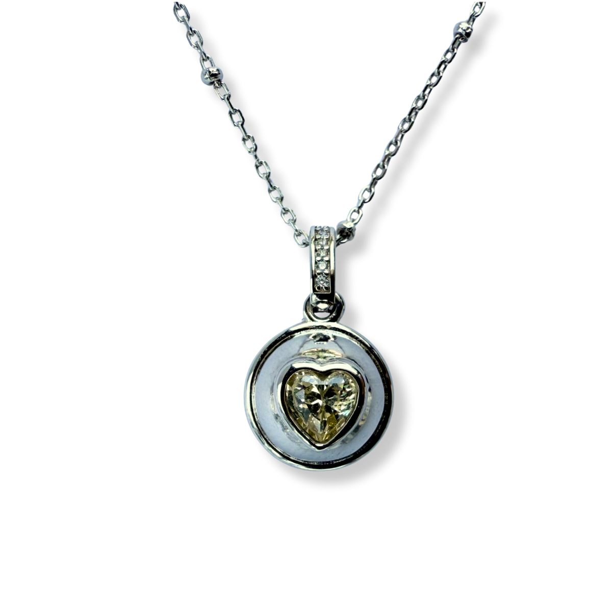 Collar de plata con baño de platino y dije bolita con corazón de circonita amarilla