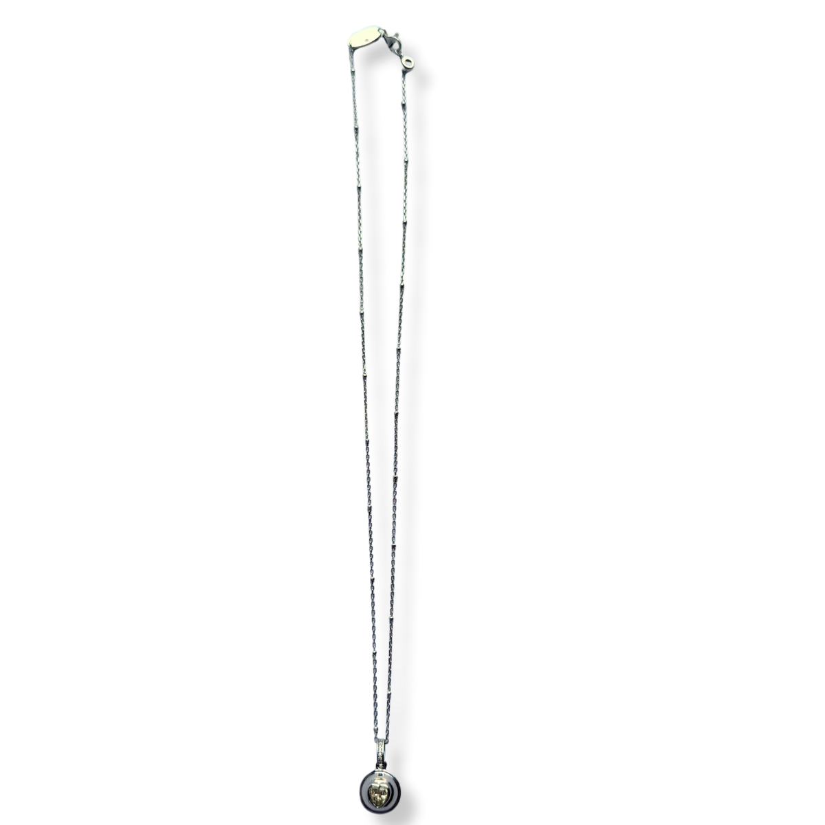 Collar de plata con baño de platino y dije bolita con corazón de circonita amarilla
