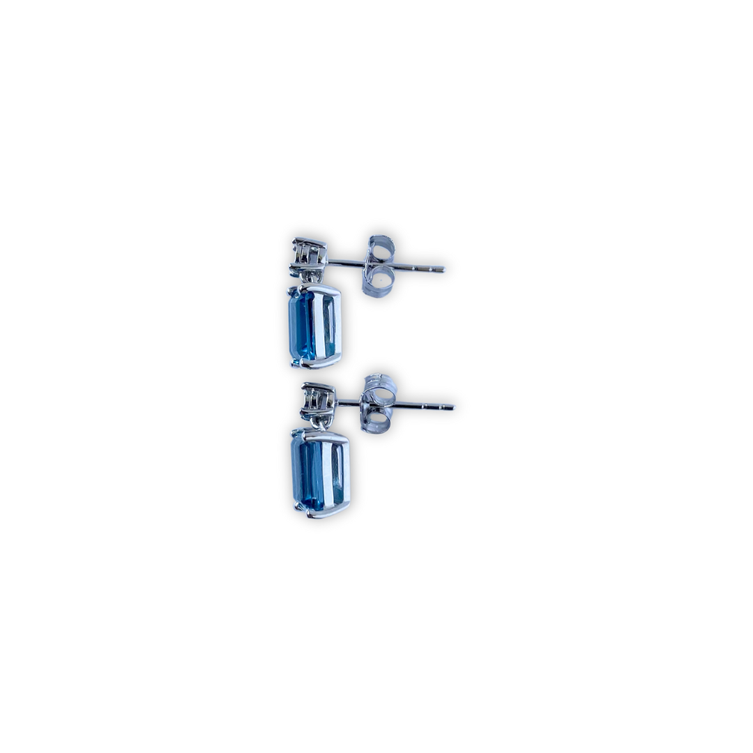 Aretes en oro blanco 10k con topacio london blue y diamantes 0.01ctw