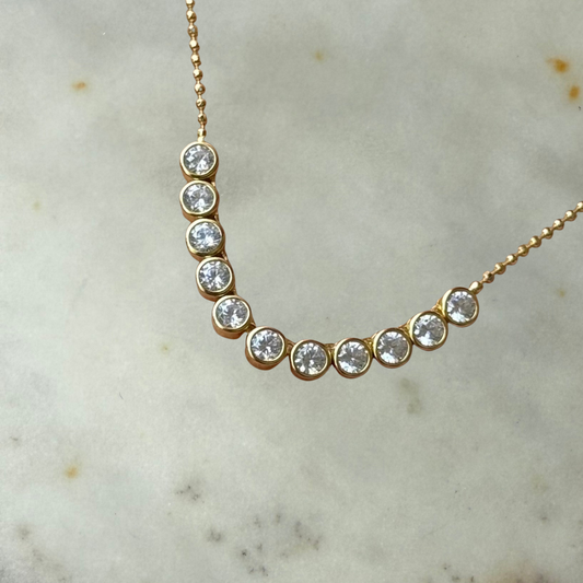 Collar de plata con baño de oro amarillo y circones redondos biselados