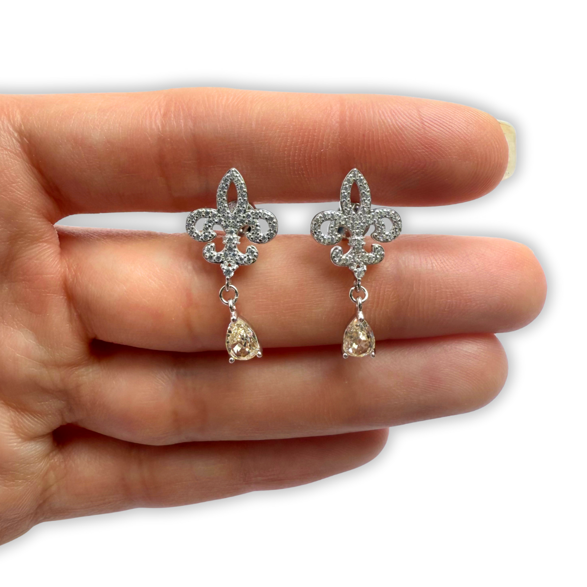 Aretes galicia de plata con baño platino y circonita color champagne
