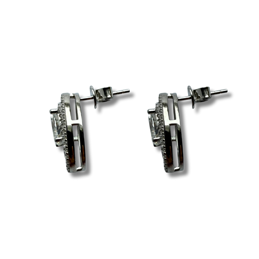 Aretes de plata con baño platino y circón ovalado y doble halo espaciado de circonitas