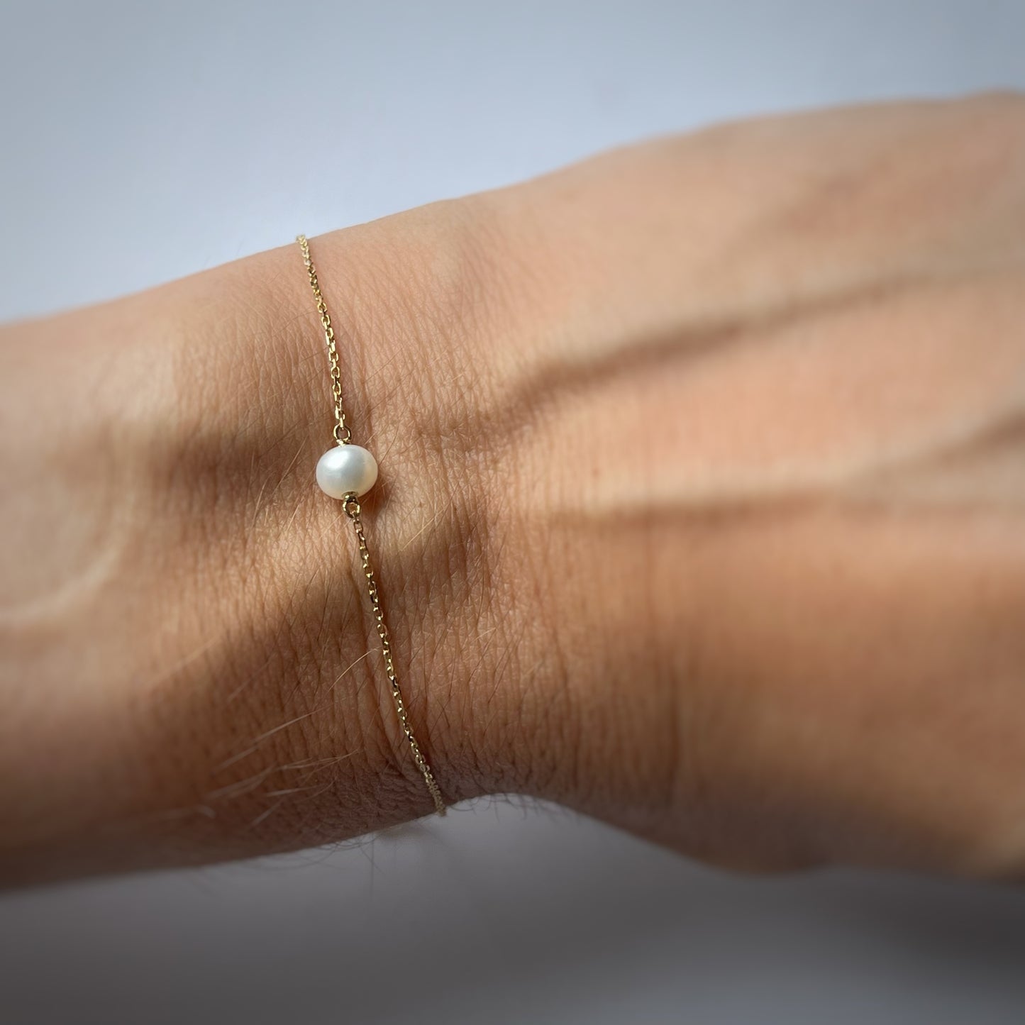 Pulsera en oro amarillo 14k y perla