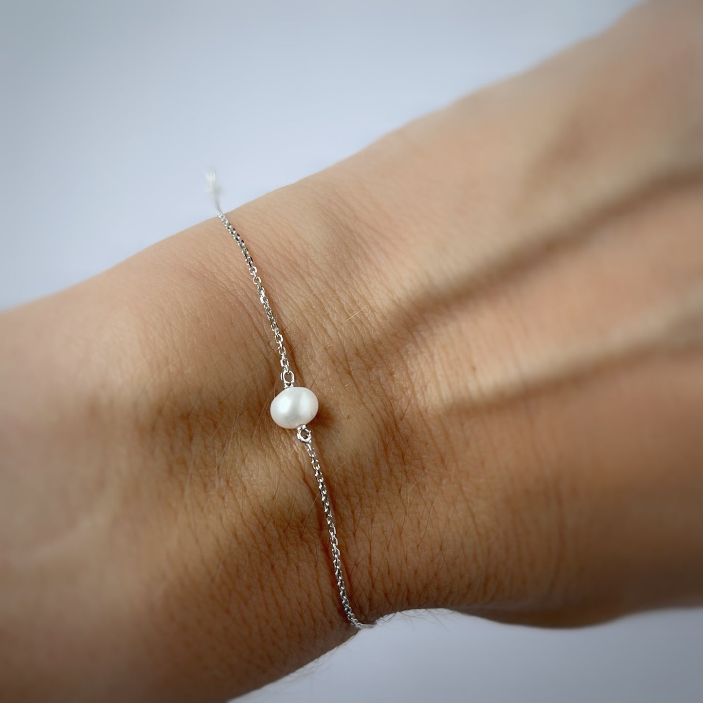 Pulsera en oro blanco 14k y perla
