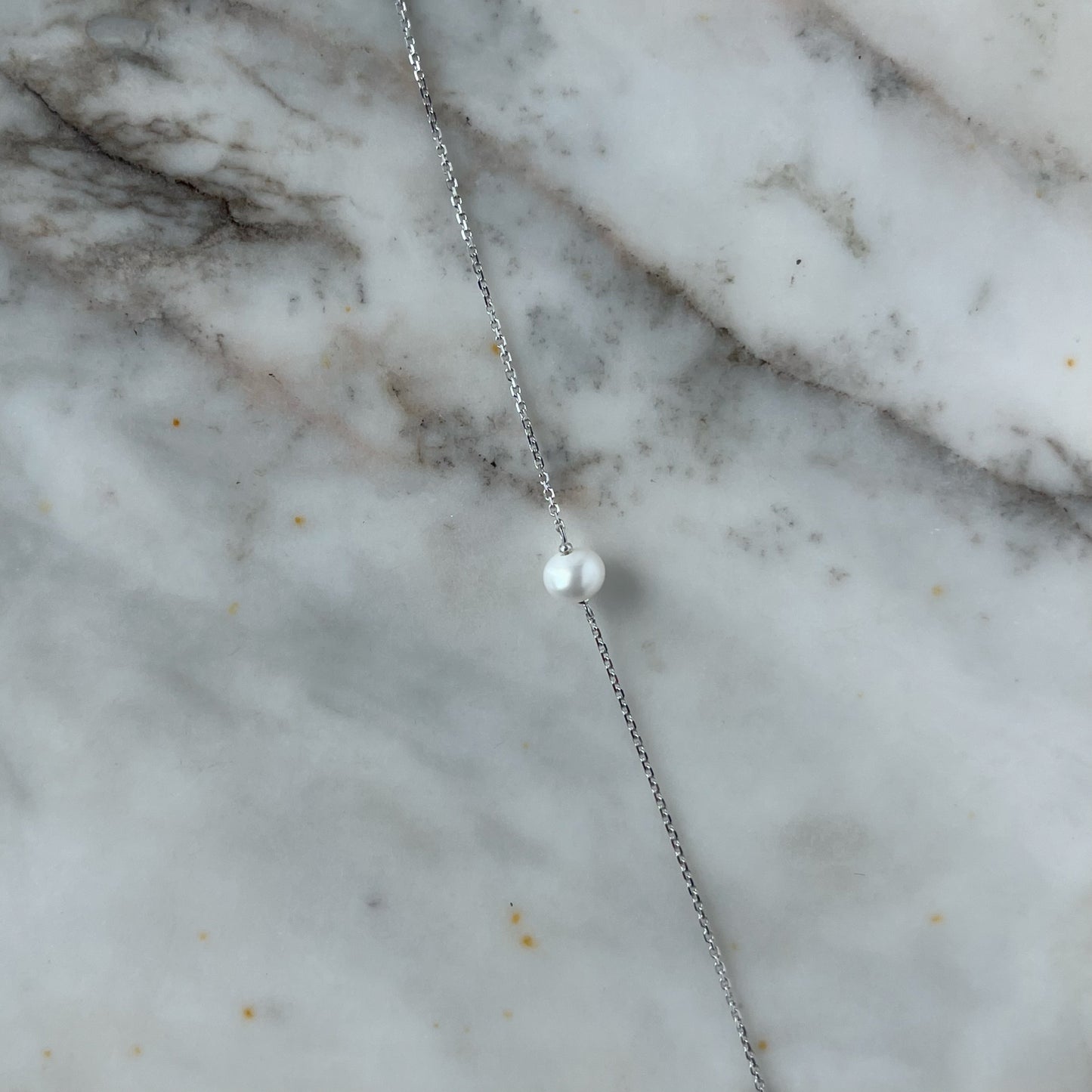 Pulsera en oro blanco 14k y perla
