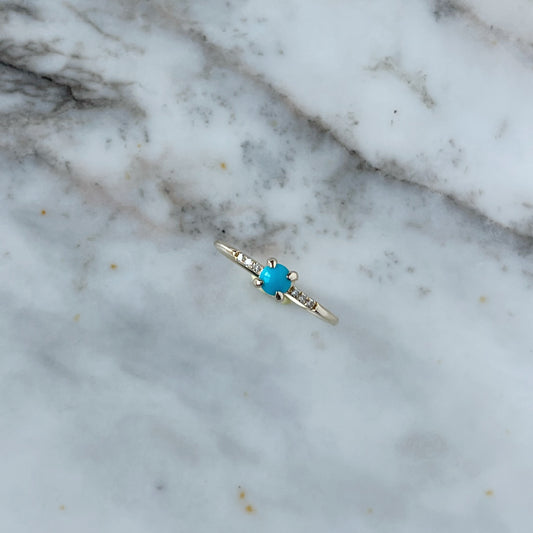 Anillo en oro amarillo 14k con turquesa 0.23ct y diamantes 0.04ctw