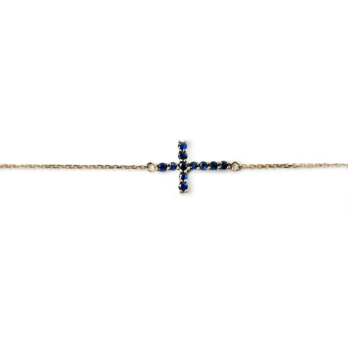 Pulsera de cadenita de oro amarillo 14K con cruz de zafiros