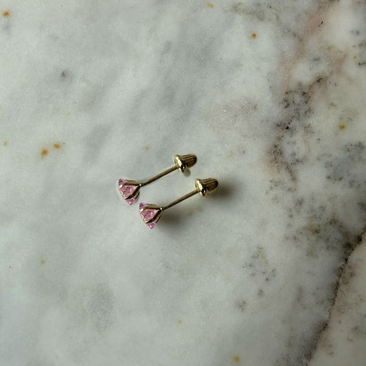 Aretes mini estrella con circón rosado en oro amarillo 14K con tope rosca