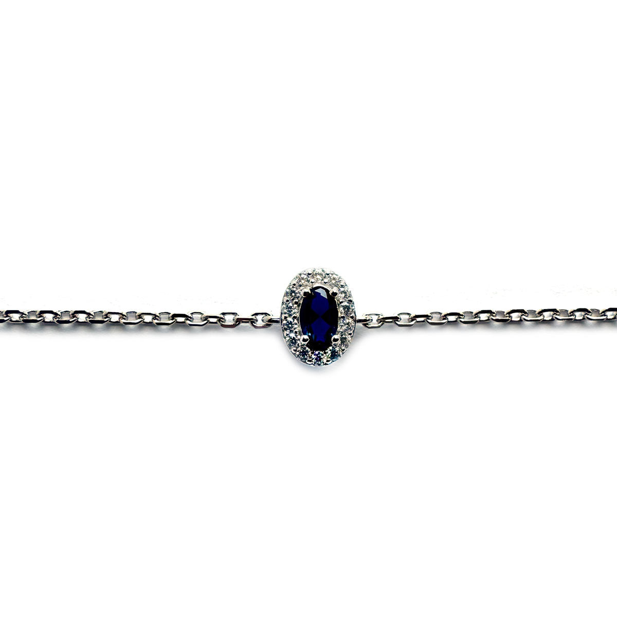 Pulsera de plata con circonita azul ovalada y halo de circonitas blancas