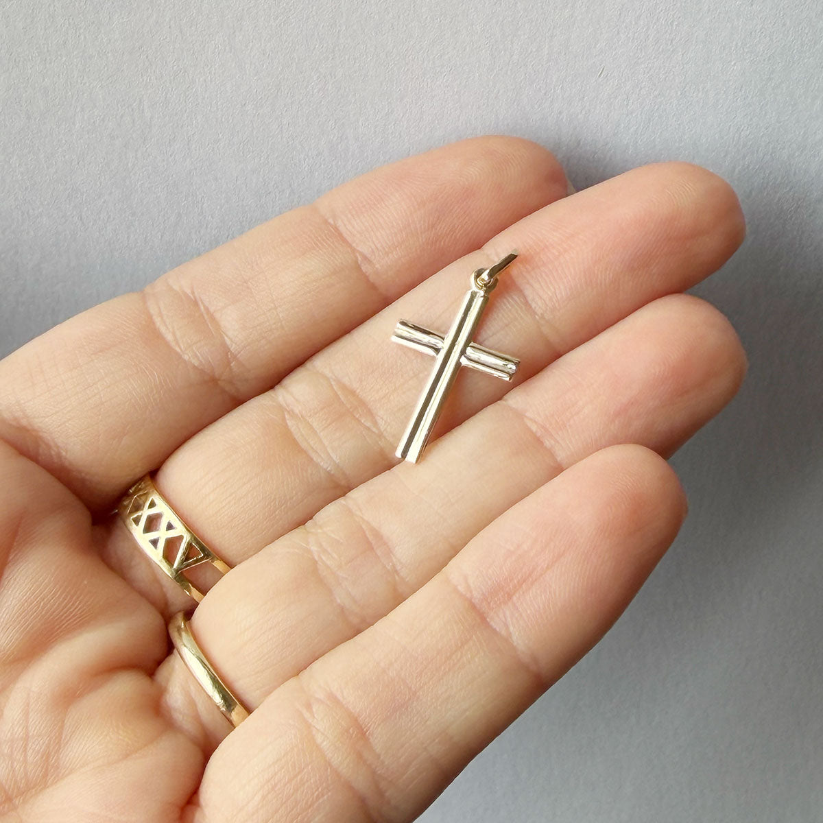 Cruz doble hilo en oro amarillo 14K