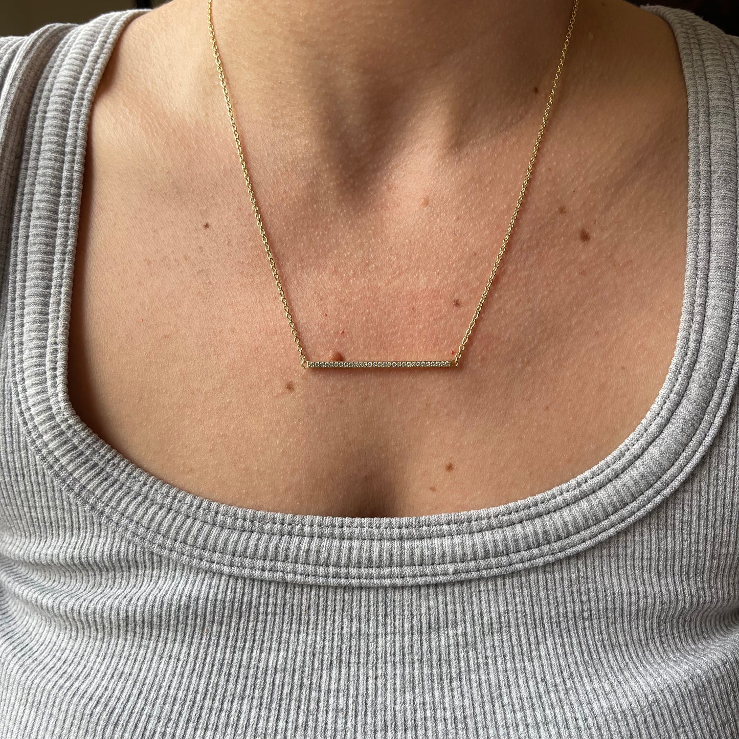 Collar en plata con baño de oro y linea de circonitas