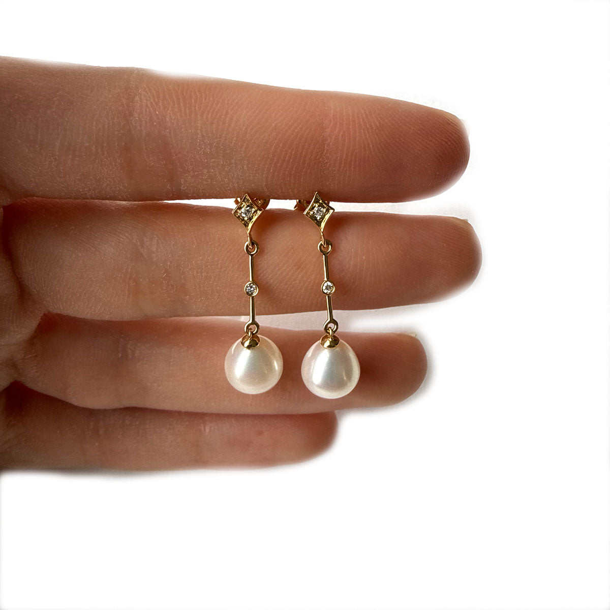Aretes largos de oro amarillo 14K con perla y diamantes 0.05ctw