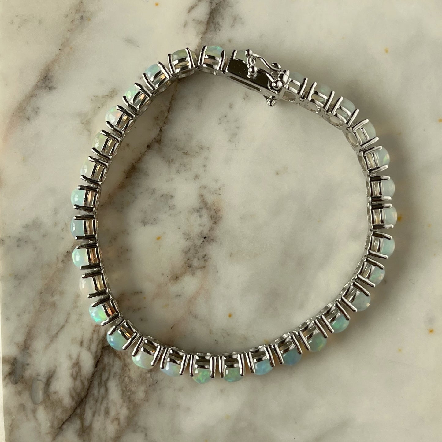 Pulsera tenis de plata y ópalo 12ctw