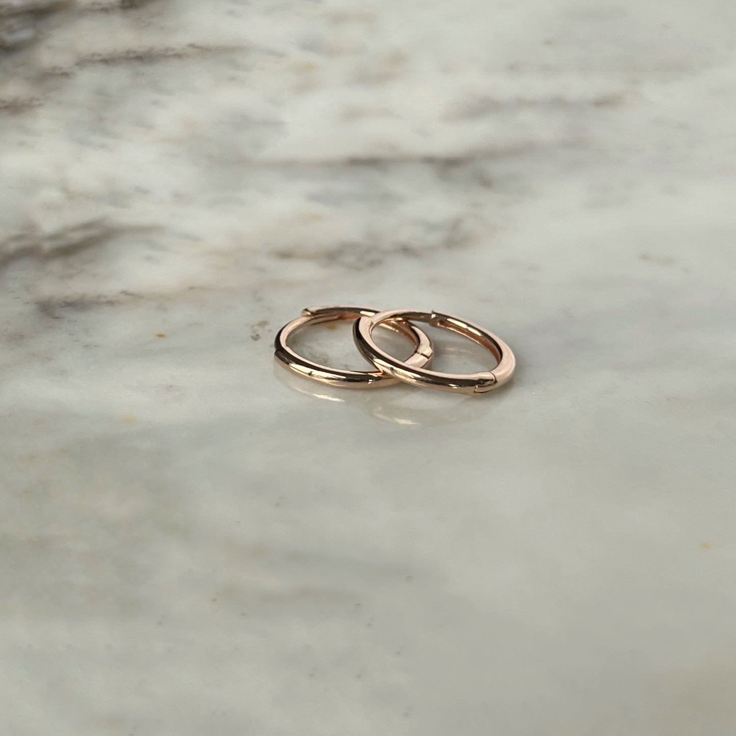 Argollas mini de oro rosa 14k