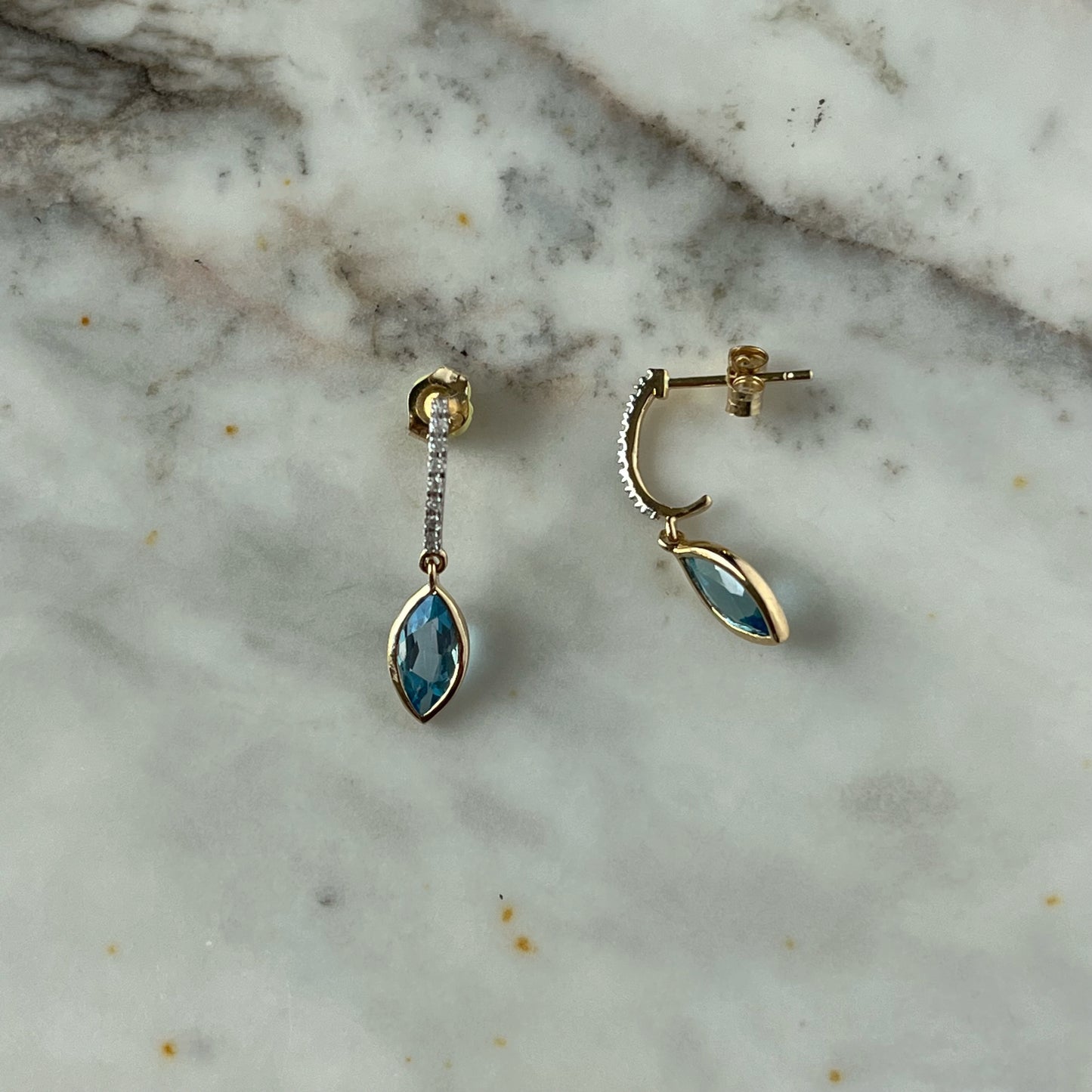 Aretes en oro amarillo 14k con diamantes y marquesa de Topacio azul