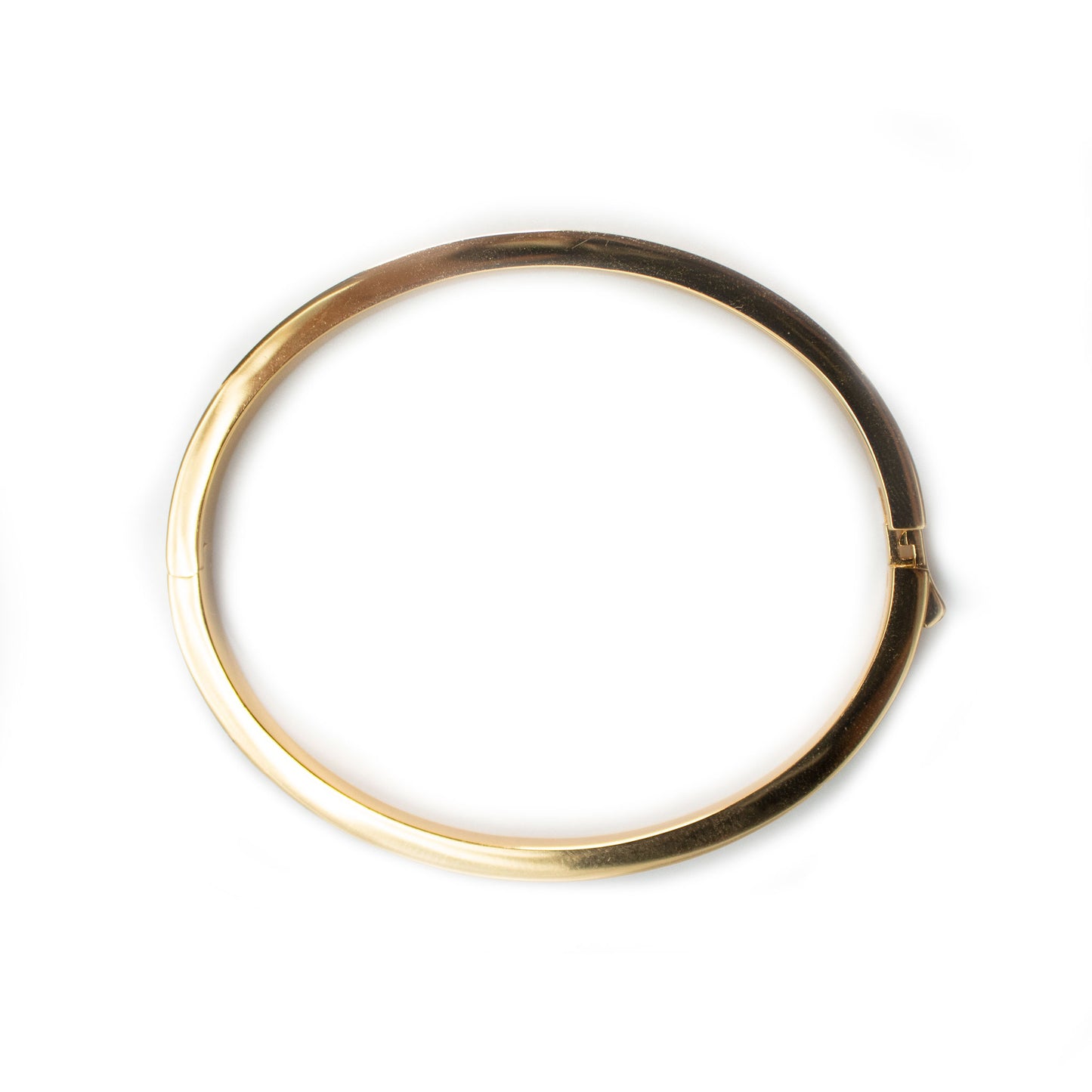 Pulsera dura en plata con baño de oro amarillo y circonitas