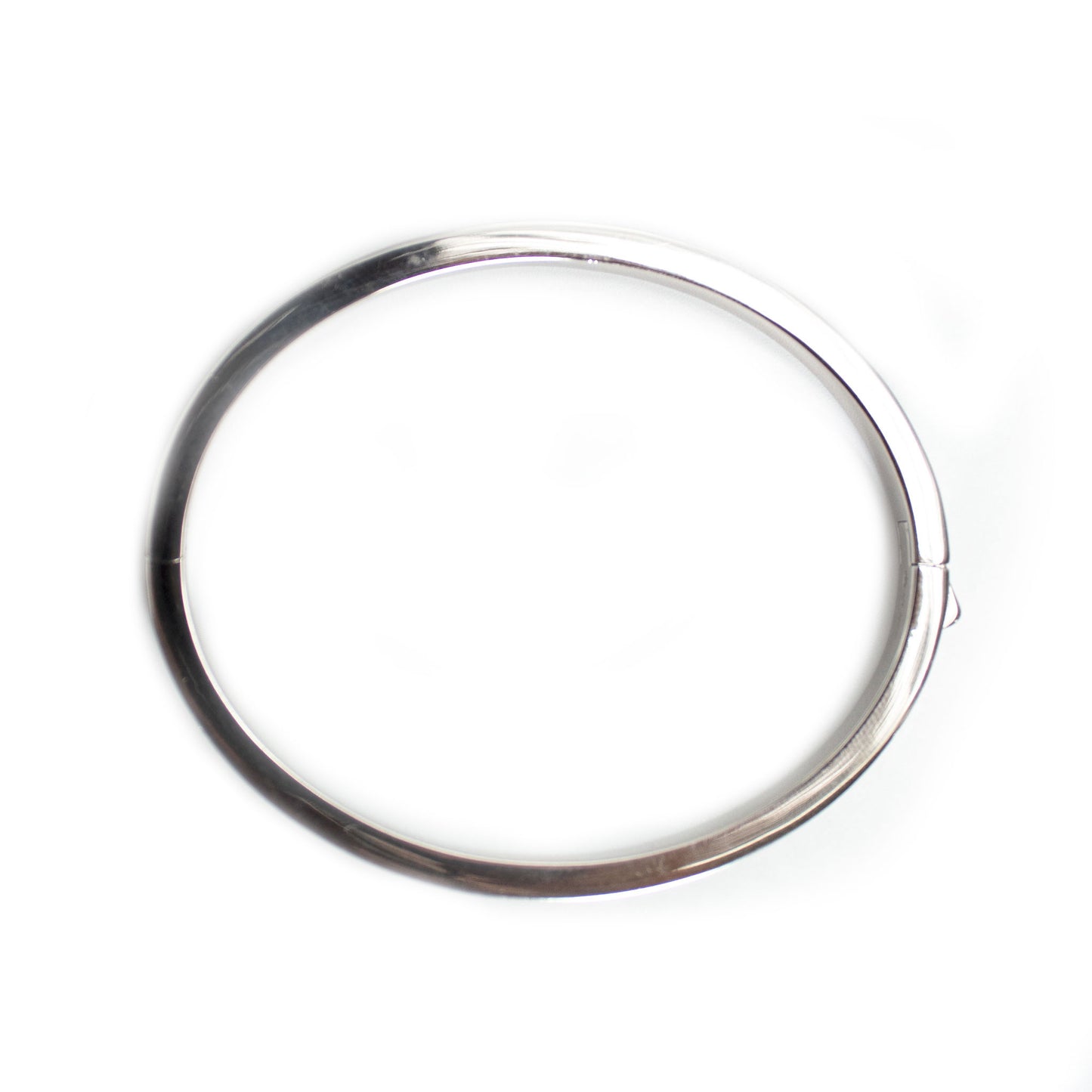 Pulsera dura en plata con baño de platino y circonitas