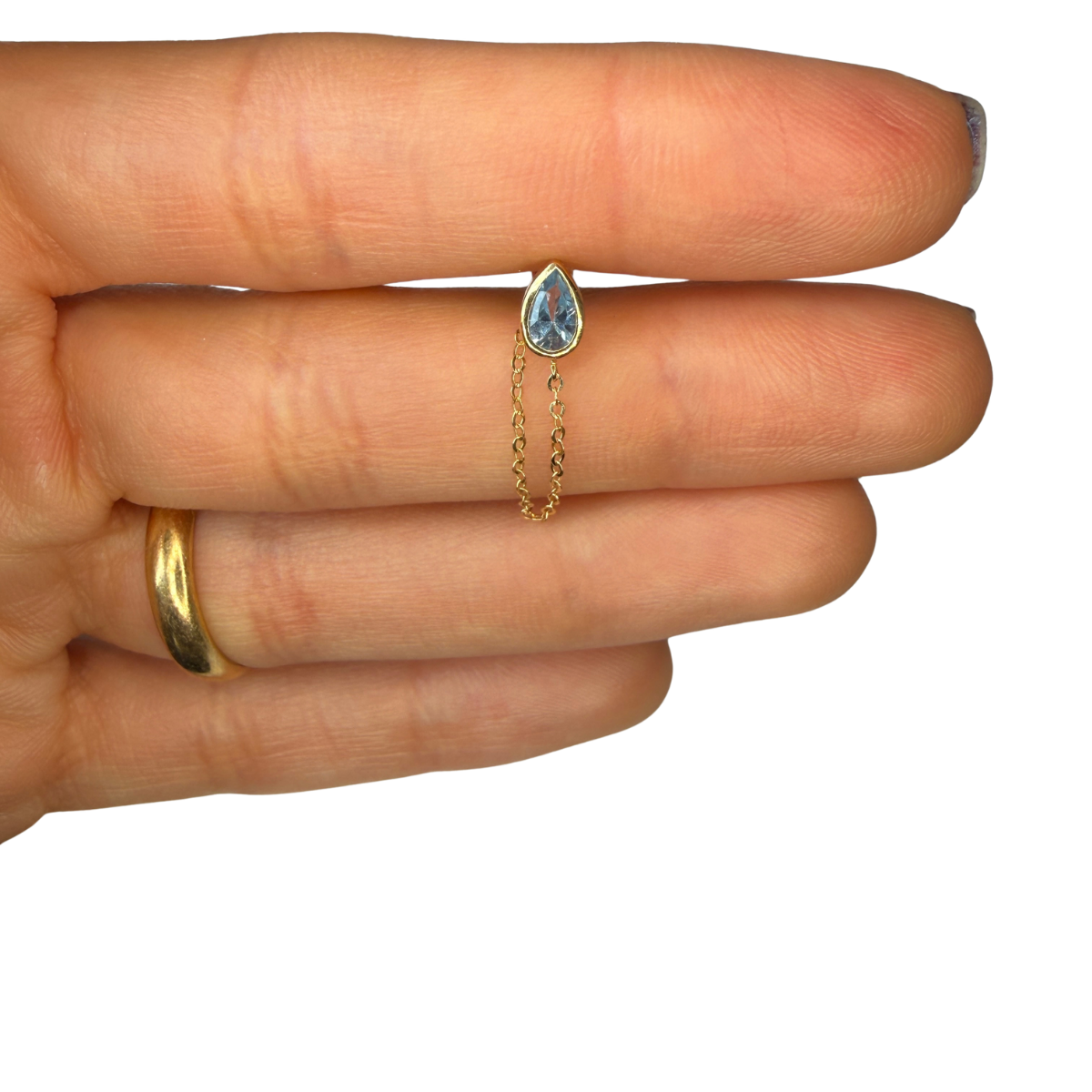 Arete en oro amarillo 14k con circonita gota celeste con cadena