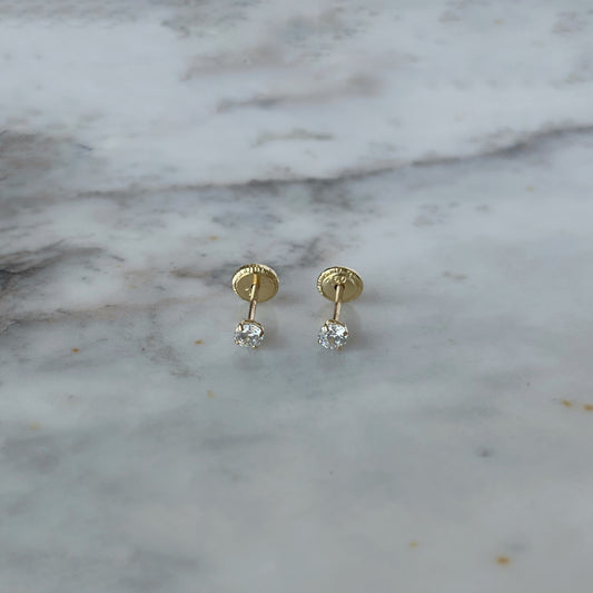 Aretes en oro amarillo de 18K con circonita redonda blanca de 3mm con tope rosca