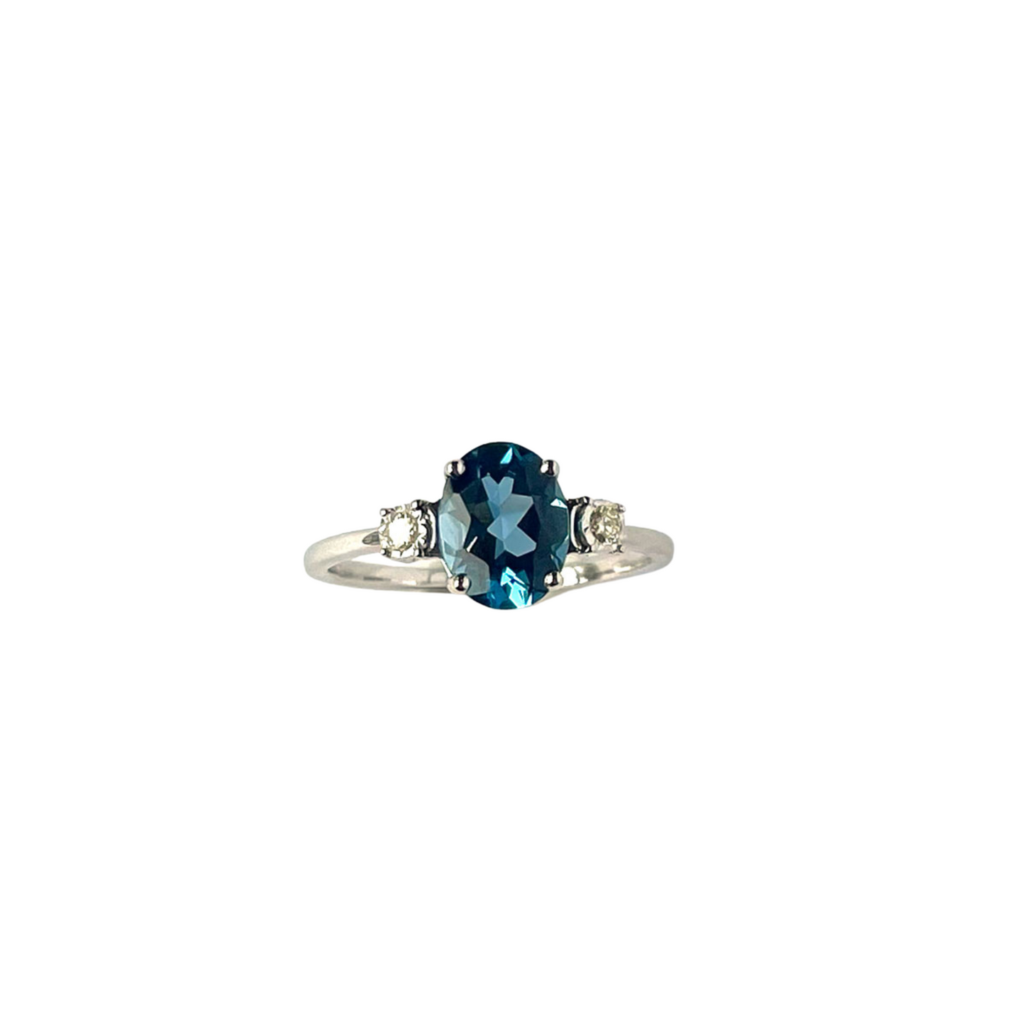 Anillo en oro blanco 10k con Topacio London Blue y diamantes 0.06ctw