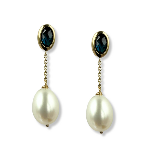 Aretes en oro amarillo 10k con topacio London Blue biselado y perla colgante