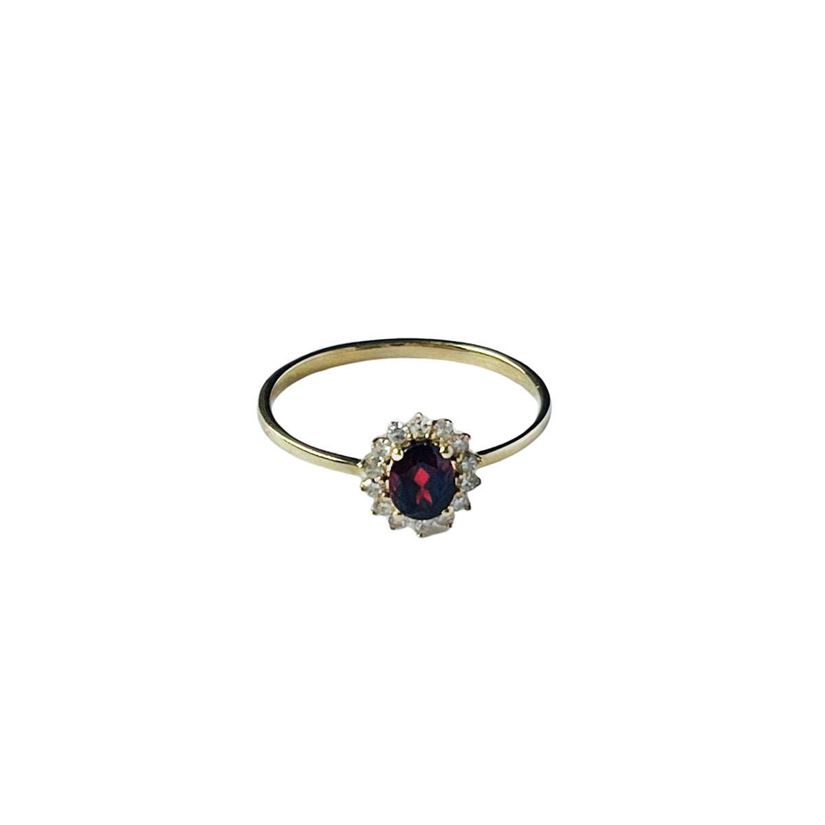 Anillo en oro amarillo 10k con granate y halo de diamantes 0.11 ctw