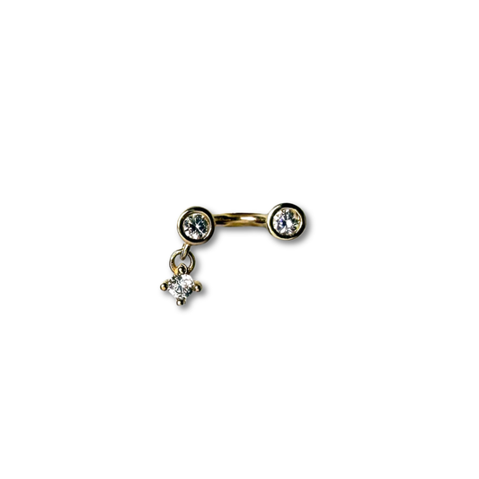 Arete piercing curva en oro amarillo 14k con tres circonitas