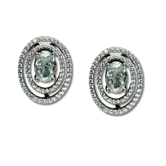 Aretes de plata con baño platino y circón ovalado y doble halo espaciado de circonitas