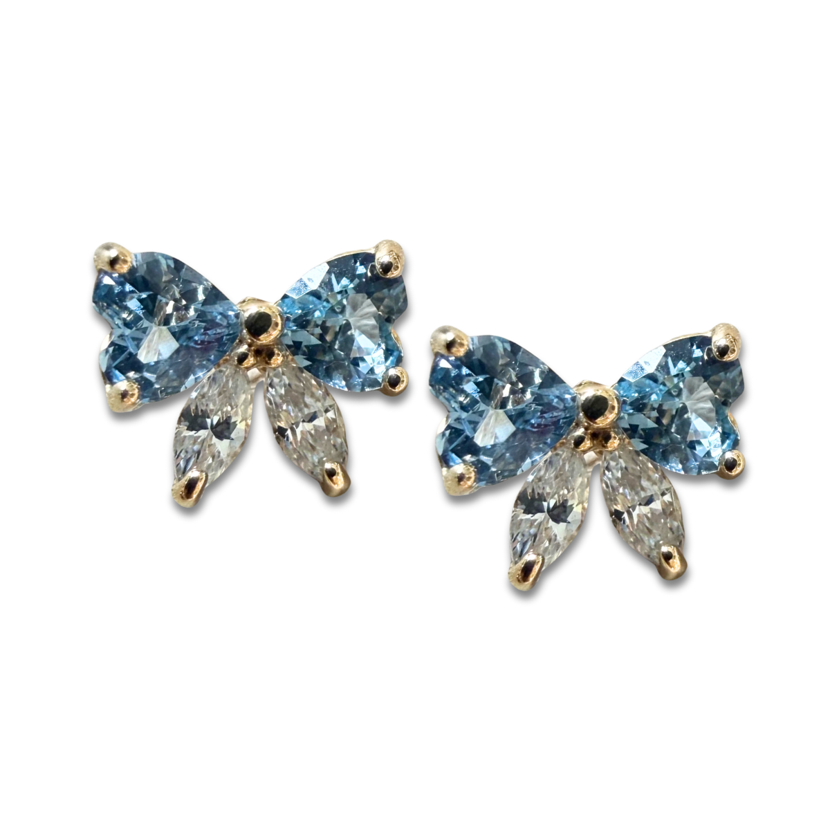 Aretes lazo con circonita celeste y blanca en oro amarillo 14K con tope rosca