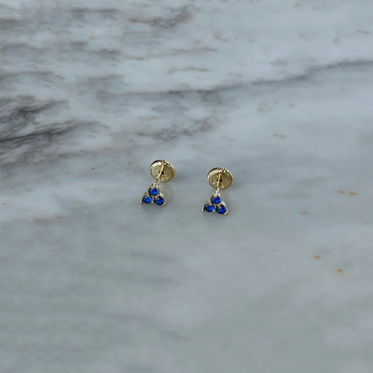 Aretes tres circonitas de color azul en oro amarillo de 14k con tope rosca