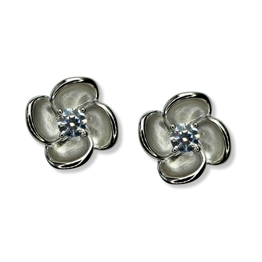 Aretes de plata con baño platino en forma de flor y circonita en el centro