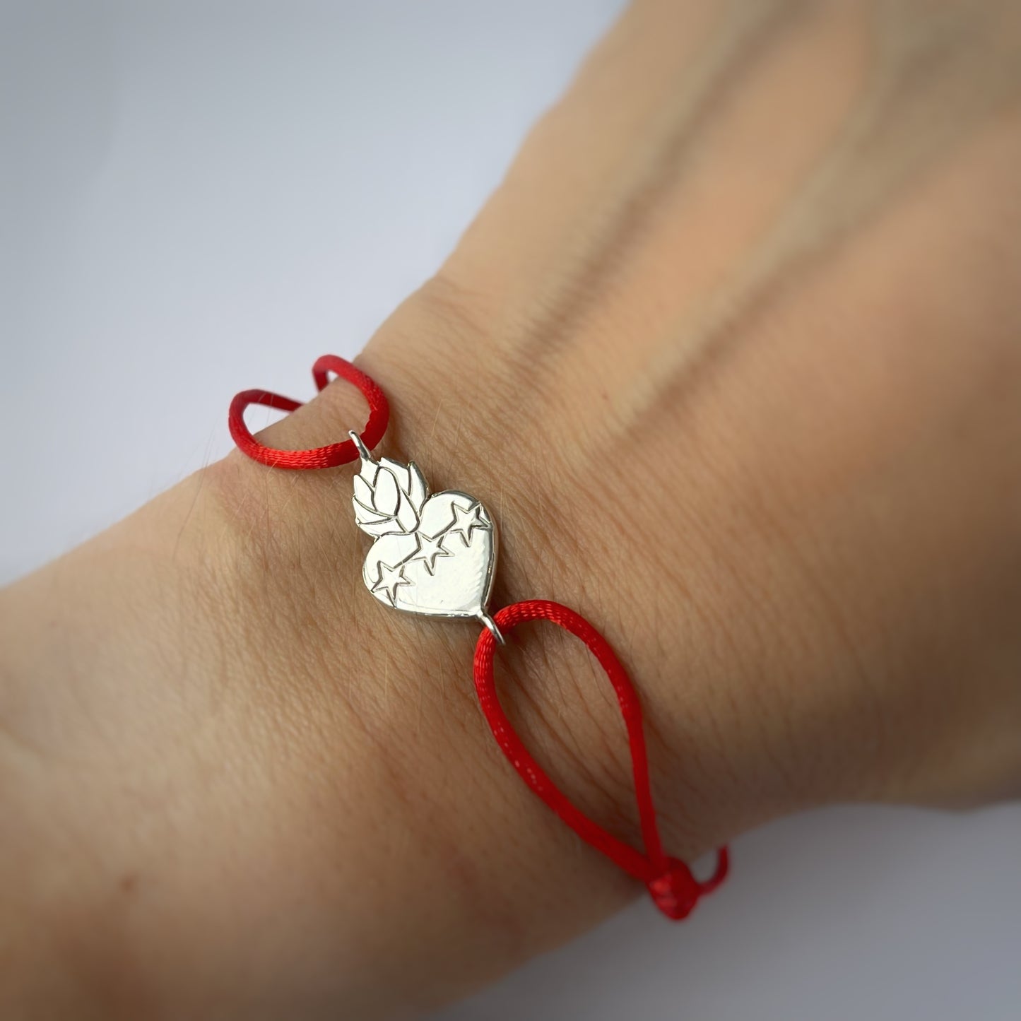 Pulsera Detente dije de Sagrado Corazón de Jesús en plata