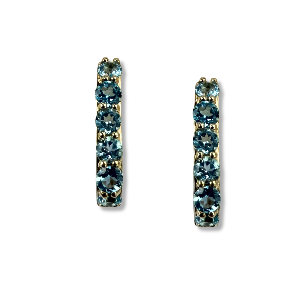 Argollas rectangulares en oro amarillo 10K con topacio azules