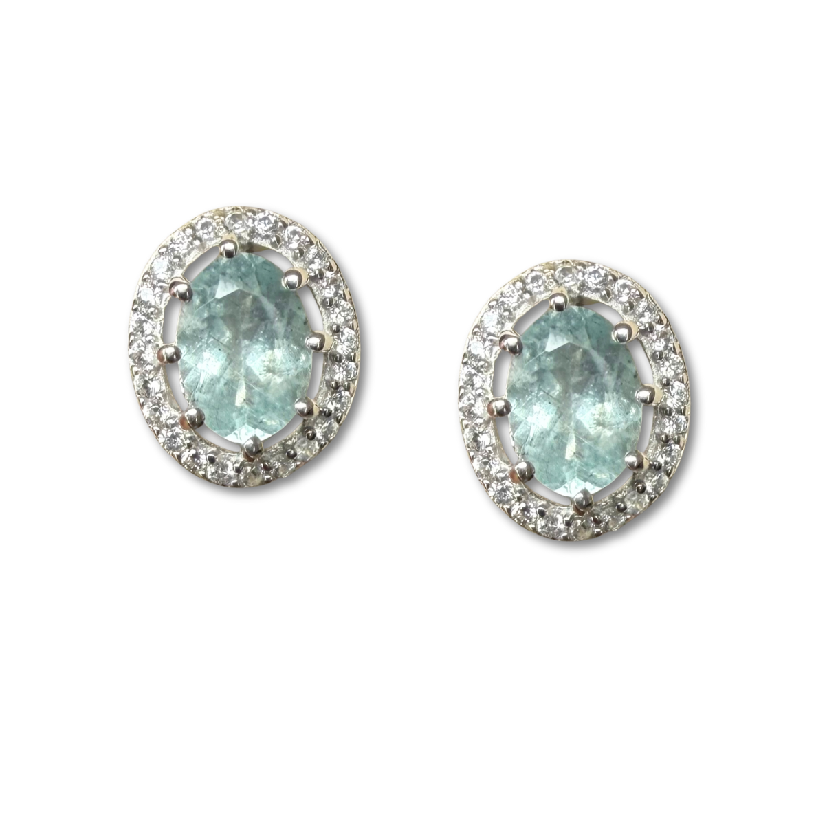 Aretes de plata con aquamarina ovalada y halo de circones