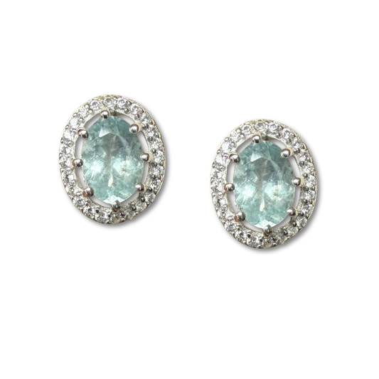Aretes de plata con aquamarina ovalada y halo de circones