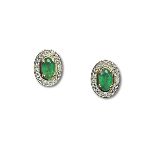 Aretes en oro amarillo 10K con esmeralda ovalada y halo de diamantes 0.05ctw