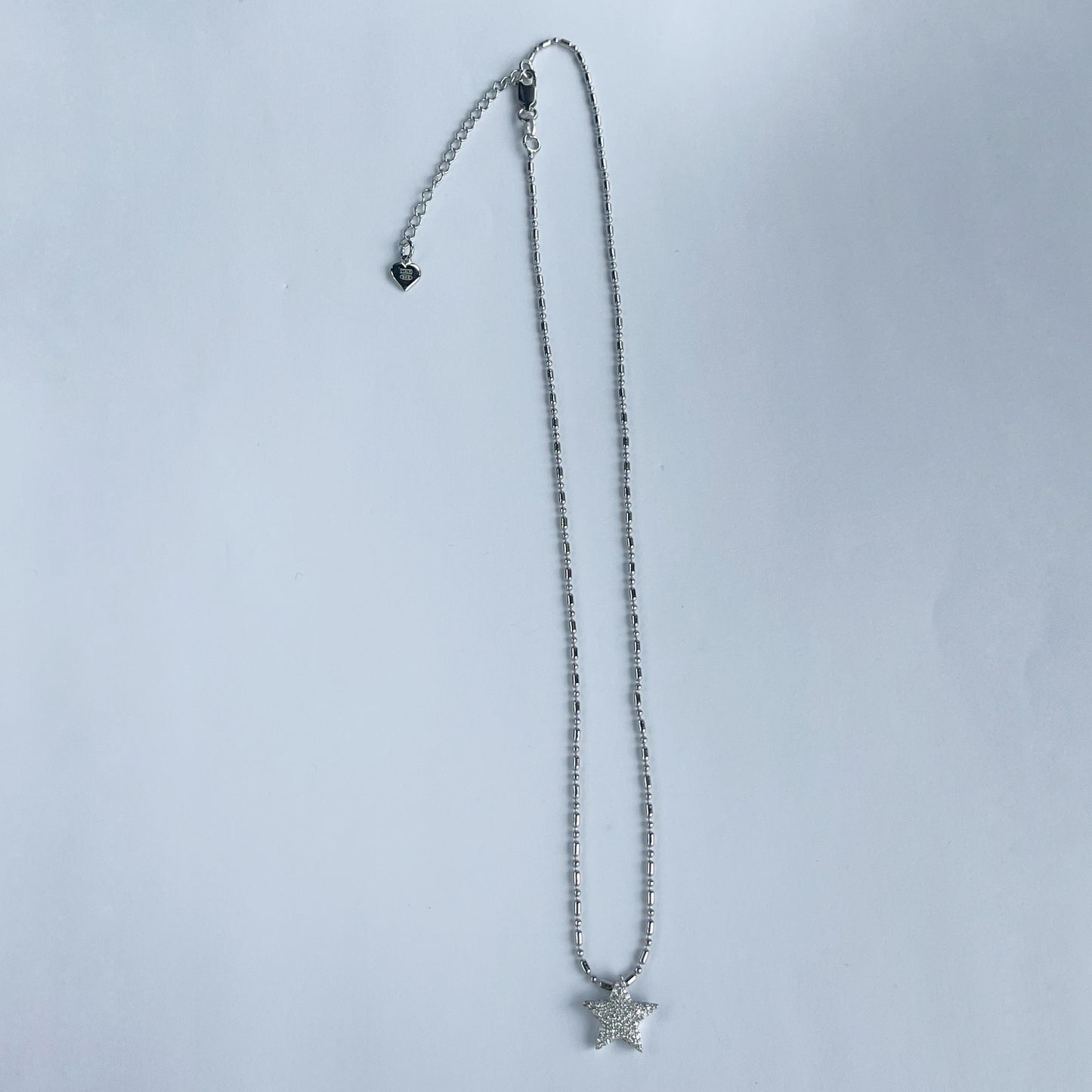 Collar en plata con dije de estrella con diamantes 0.25ctw