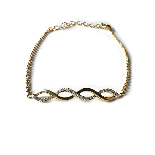Pulsera en oro amarillo 10k con dije central de curvas con diamantes 0.09ctw
