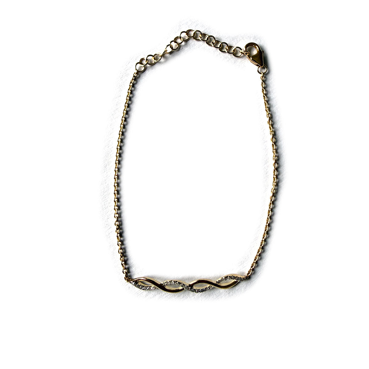Pulsera en oro amarillo 10k con dije central de curvas con diamantes 0.09ctw