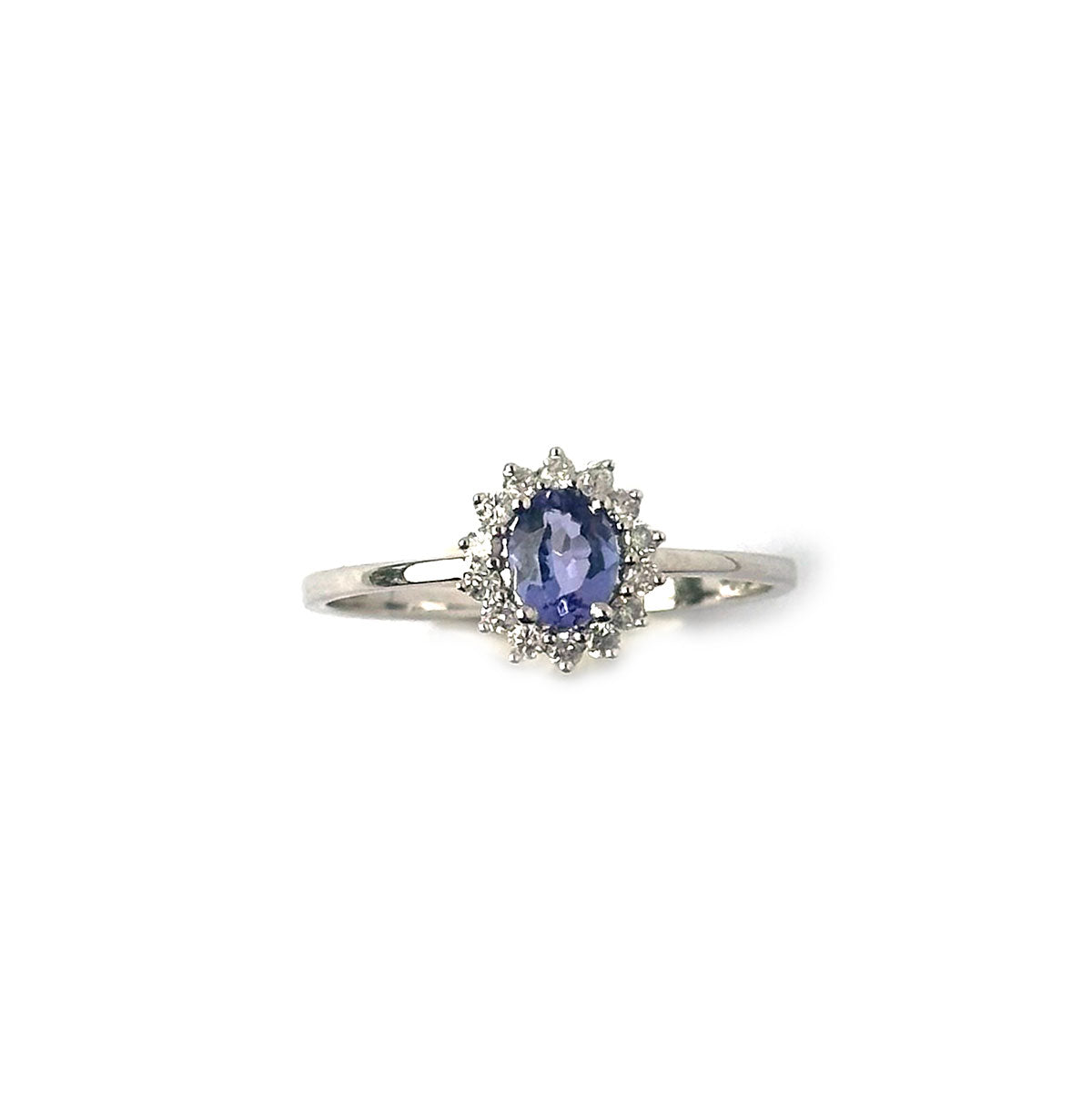 Anillo en oro blanco 14k con tanzanita ovalada 0.38ct  y halo de diamantes 0.11ctw
