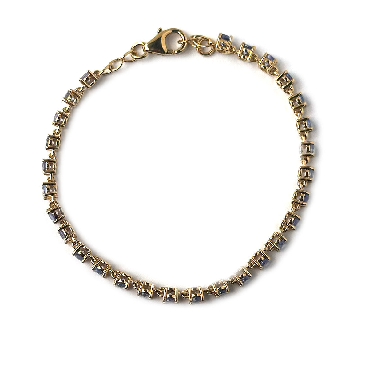 Pulsera de tanzanitas redondas en plata con baño de oro amarillo