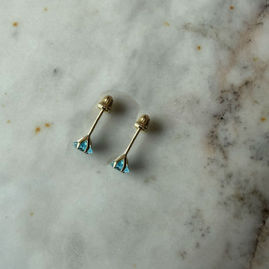 Aretes mini estrella con circón celeste en oro amarillo 14K con tope rosca