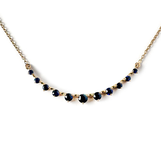 Collar en oro amarillo 10k con curva de zafiros