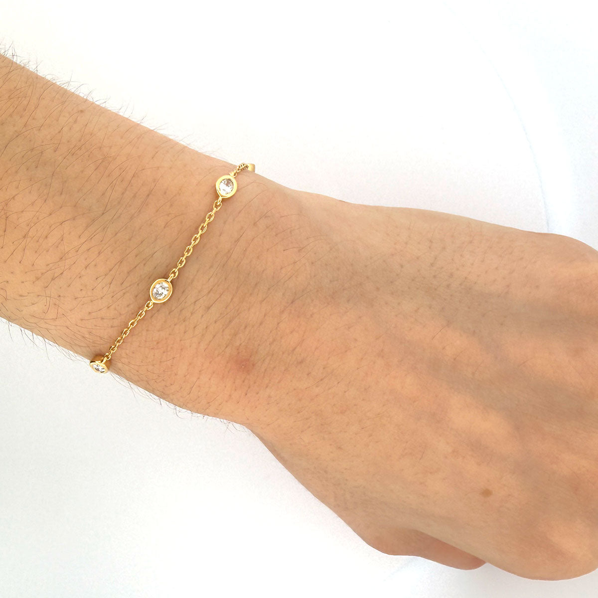 Pulsera de plata en baño de oro amarillo con diamantes ovalados de laboratorio 1ctw