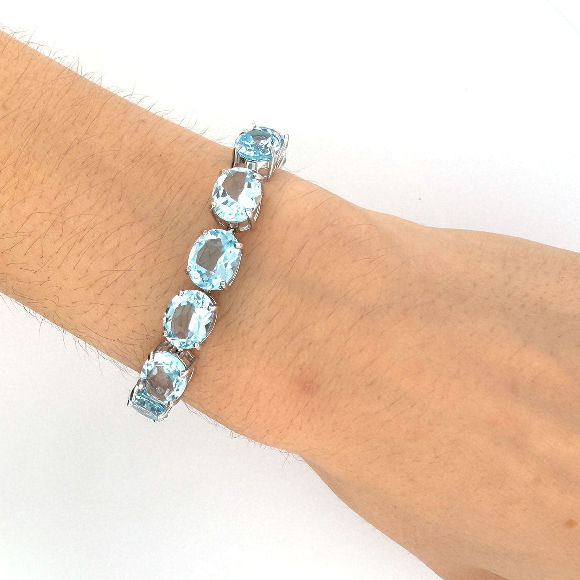 Pulsera tenis de plata con topacios azules 40ctw
