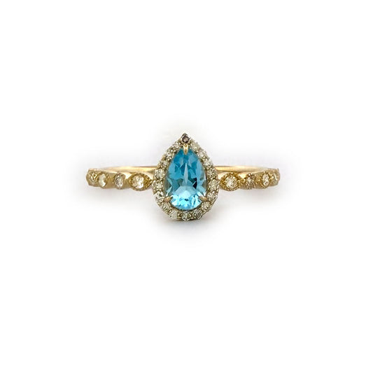 Anillo en oro amarillo 10K con topacio corte pera y diamantes 0.20ctw